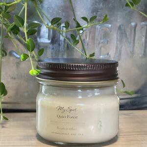 handmade soy candle quiet forest in glass jar with natural greenery