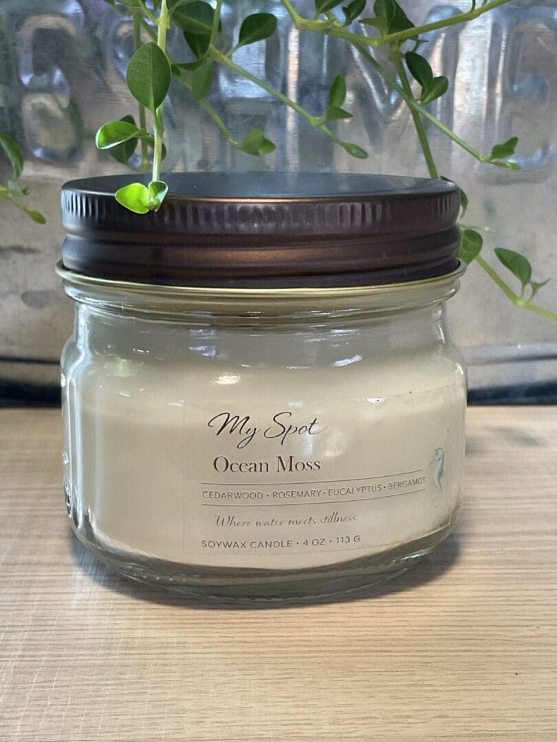 Ocean Moss soy candle in clear glass jar with wood wick, minimalist label